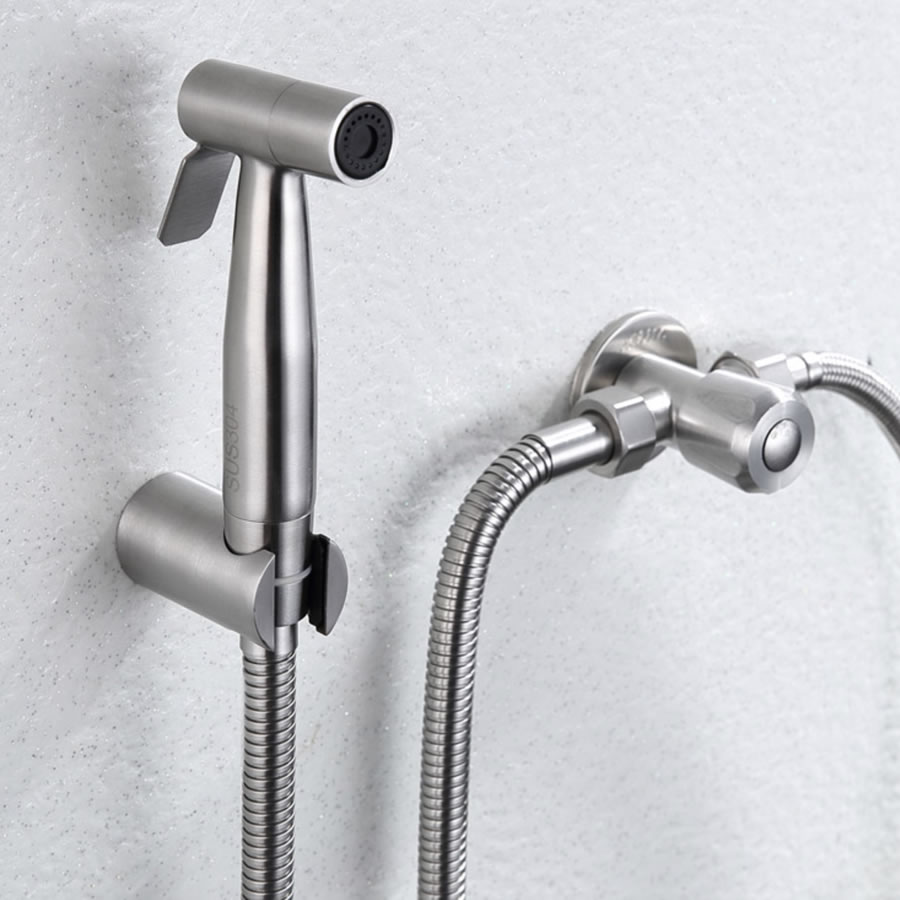 A stainless steel handheld bidet sprayer on a braided hose